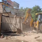 Congress Leader and Supporters Stop Demolition Drive