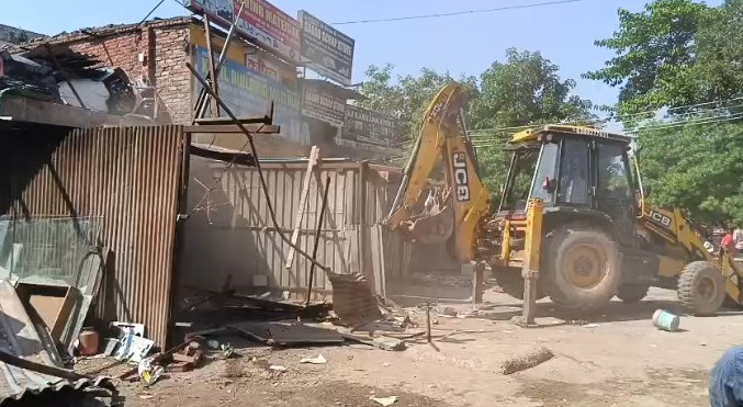 Congress Leader and Supporters Stop Demolition Drive